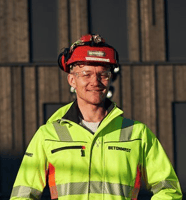 Photo of Christopher Carlsen Head of Innovation at Betonmast at the construction jobsite. Christopher Carlsen is happy using Imerso platform